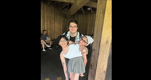 Picture of conjoined twins Carmen and Lupita with Carmen's husband, Daniel McCormack.