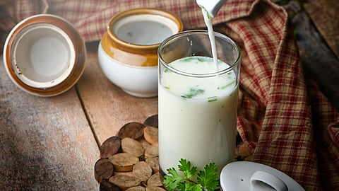 Buttermilk is being poured into a glass.