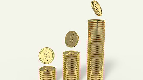 Image showing tower of gold coins  in ascending order having white background.