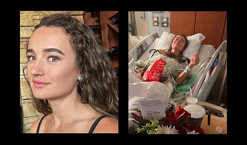 Kelley Mack posing in front of a brick wall.