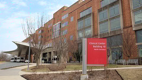 NIH clinical center and a red board in front of it.