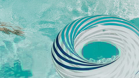 Image showing tube in a swimming pool having germs but appears to be blue.