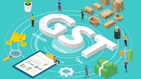 GST (Goods and Services Tax) illustrated on a blue surface, surrounded by people, boxes, and gold coins - symbolizing its impact on businesses and everyday lives.
