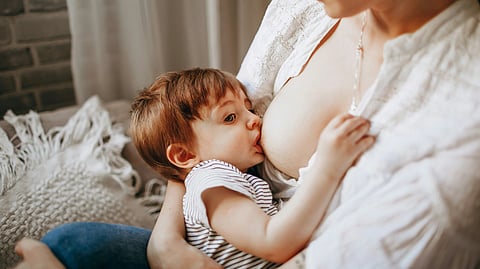 Image of a woman breastfeeding her child.