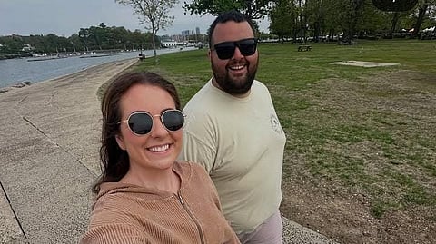 An instagram post of a woman and a guy on a walk