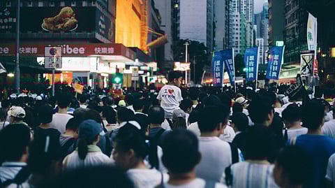 Image of a crowded place full of people on the streets of USA.