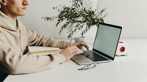 guy sitting with laptop