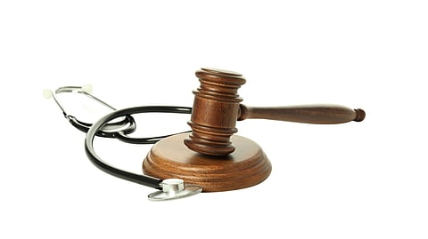 A gavel on a stethoscope indicating a medical legal issue.