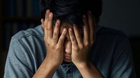 An image of a boy looking distressed.