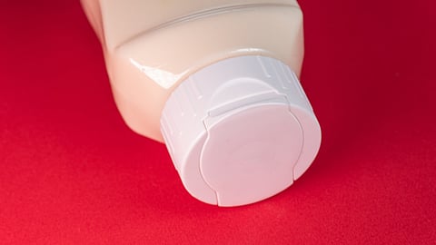 Representational image of Pepto-Bismol in front of a red background.