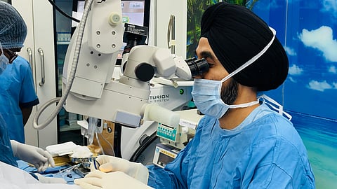 An image of a doctor performing cataract surgery.