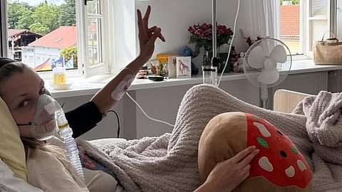 An image of Bella Hadid hooked to IV and wearing an oxygen mask.