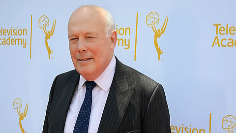 An image of Julian Fellowes in a black suit at an event.