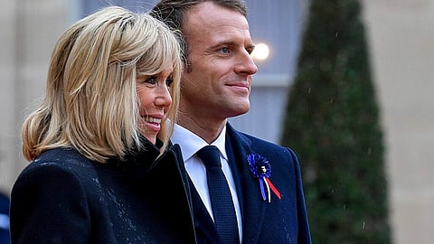 Brigitte Macron and Emmanuel Macron at a public event, ready to defend her identity in court.