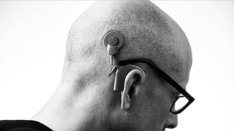 An image of a man wearing hearing aid.