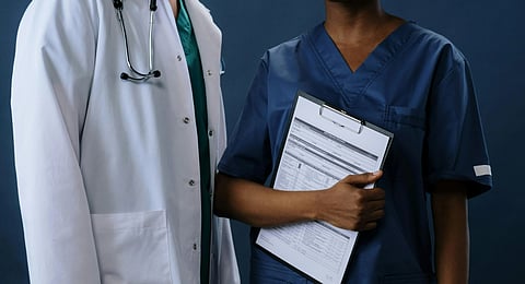 An image of a doctor and medical staff.