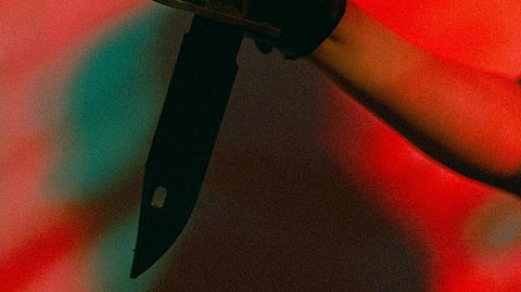 An image of a knife in hand.