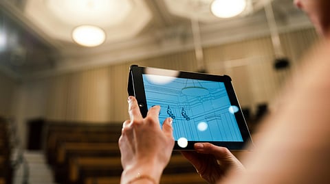 An image of a girl using a software on tab.