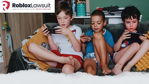 Three children playing on tablets, with text about a Roblox lawsuit and online abuse impact.