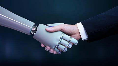 Image of a person in suit shaking hands with an ai robot.