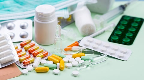 Image of different forms of  medicines on a shelf.