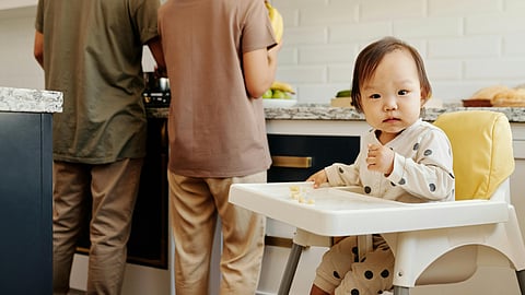 Image of a baby eating infant food.