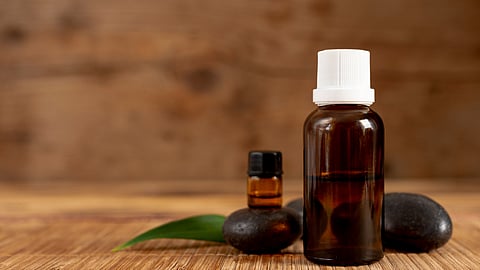 A dark colored bottle placed on a table.