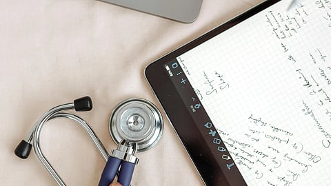 An image of stethoscope and tab.