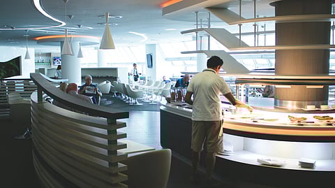 An image of a man at a food buffet at hotel.