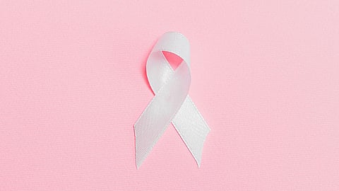 Image of a pink ribbon over a pink background.