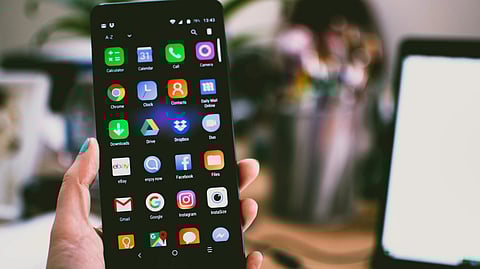 Image of a phone showing different apps on the mobile.