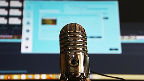 Image of a mic in front of a blurry background.