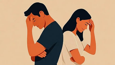 An image of a couple looking away from eachother.