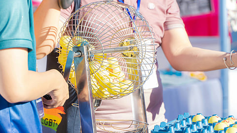 Image of a lottery draw being done in a fair.