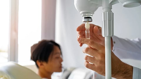An IV is being administered to a patient.