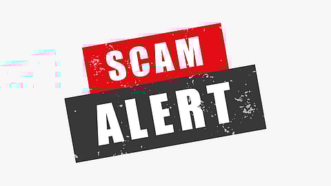 'Scam alert' written in red and black background.
