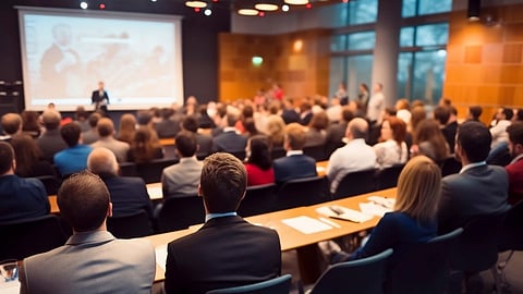A large gathering of a people in a meeting or conference. 