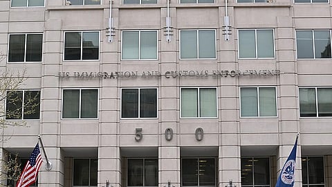 A grey building with a name of U.S. Immigration and Customs Enforcement on it. 