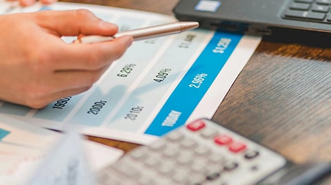An image of calculator and rate sheet.
