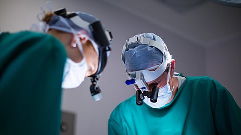 An image of 2 surgeons.