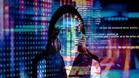 Image of a woman behind the rays of lights of different colors.