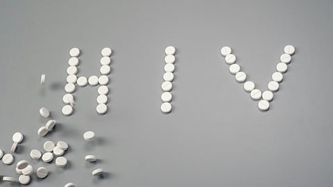 Image showing HIV written over it with white tablets.