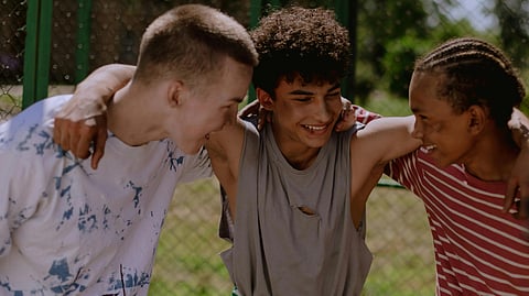 An image of 3 happy teens.