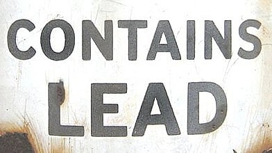 Image of a sign board showing lead content warning.