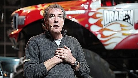 Image of Jeremy Clarkson giving a speech at an event while wearing a grey sweater.