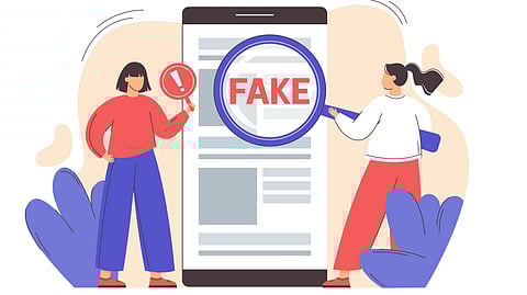 An illustration showing a magnifying glass on to a paper on which fake is written in red letters which is highlighted.