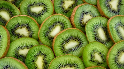 Image of slices of kiwifruit one over the other as these are better for constipation.