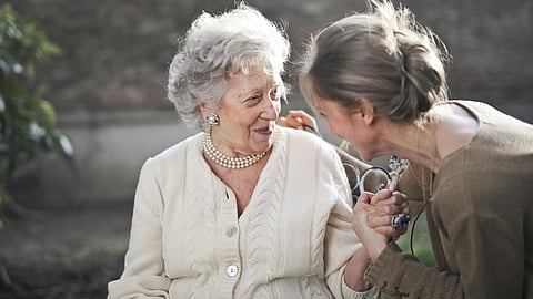 An image of a old woman and a young woman.