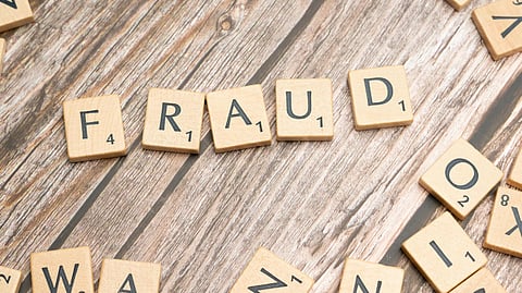 Image of wooden blocks having fraud written to it.