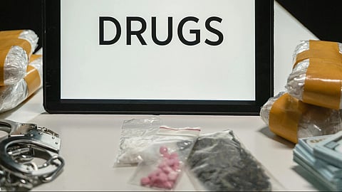An image of drugs text on a white screen and packages. 